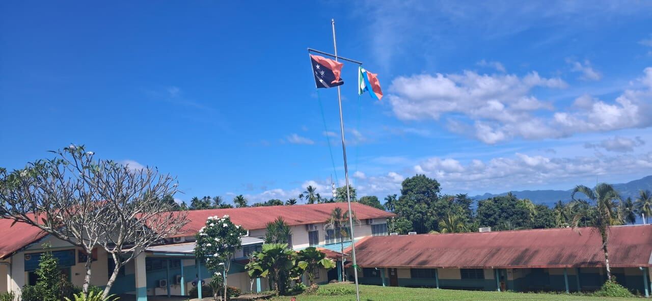 The national flag and the Milne Bay provincial flag fly together at MBPHA headquarters in Alotau.